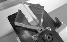 a glass knife shown on a microscope