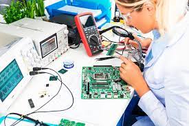 technician fixing electronic components