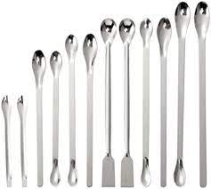 a set of spoons with various sizes some of which are double ended or have a spatula on the other end.