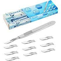 a scalpel shown next to its box and the multitude of replacement tips it comes with.