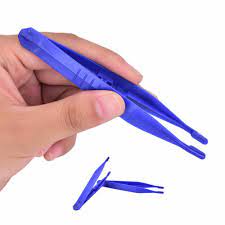 a hand showing off a set of plastic tweezers