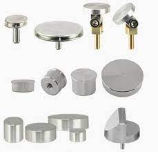  a set of varying pieces of metal including but not limited to a round pin, a cylinder and a fat disk