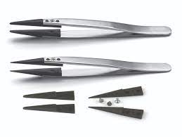 a set of rubber tweezer tips displayed both on and off the tweezers.