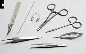 a set of various tools including multiple tweezers, a scalpel and some scissors 